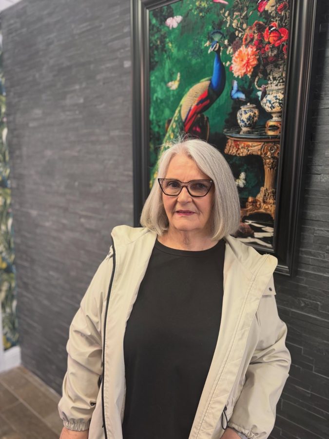 A happy patient wearing new glasses