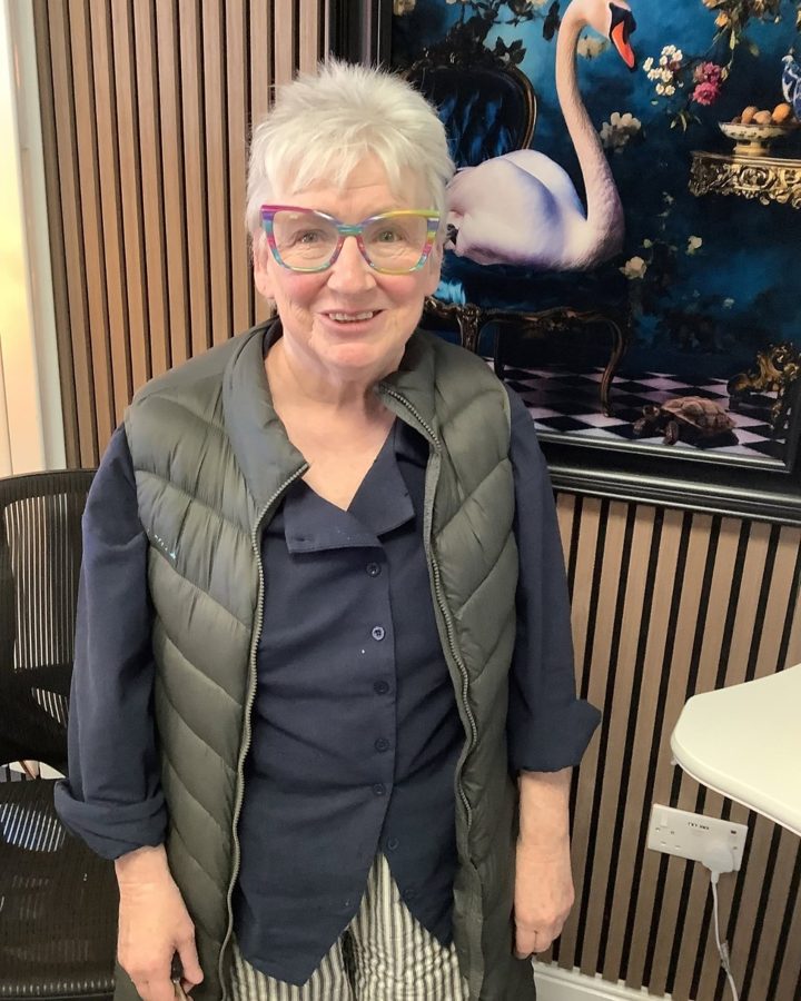 A happy patient wearing new glasses