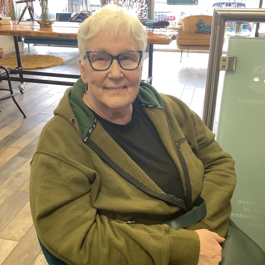 A happy patient wearing new glasses