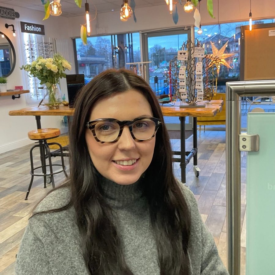 A happy patient wearing new glasses